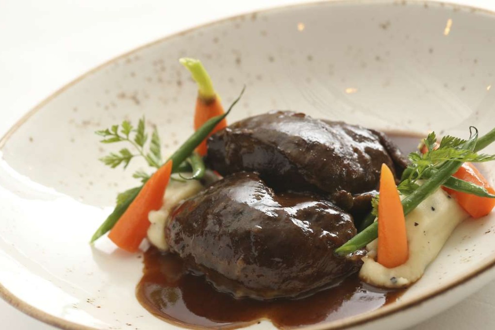 Slow-cooked Iberico pork cheek in tempranillo wine sauce with black truffle potato purée by Pedro Samper. Photo: Dickson Lee