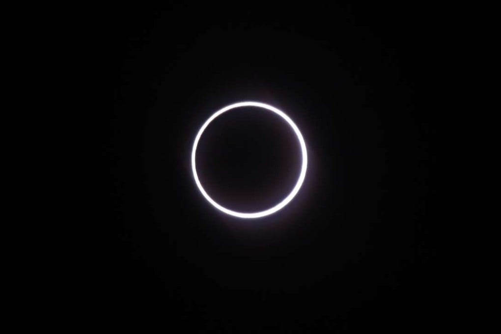 A photo taken in Saint-Louis, on the Indian Ocean island of La Reunion, shows the moon covering the sun, leaving a ring of fire effect around the moon, during an annular solar eclipse. Photo: AFP