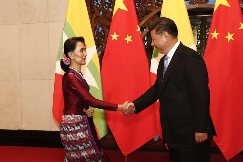 President Xi Jinping greets Aung San Suu Kyi before a meeting at the Diaoyutai State Guesthouse in Beijing on August 19. Photo: EPA
