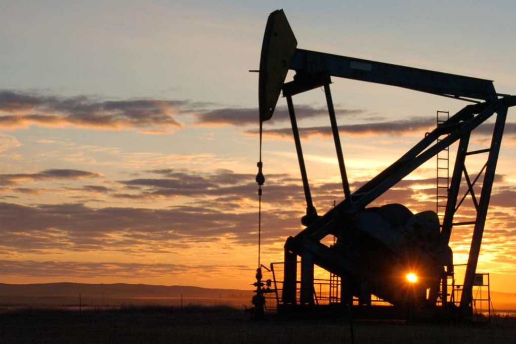FILE - In this Nov. 6, 2013, file photo, a Whiting Petroleum Co. pump jack pulls crude oil from the Bakken region of the Northern Plains near Bainville, Mont. Discoveries of vast reserves of oil and the slow progress of alternatives in recent years has given rise to a very different outlook on oil prices. (AP Photo/Matthew Brown, File)