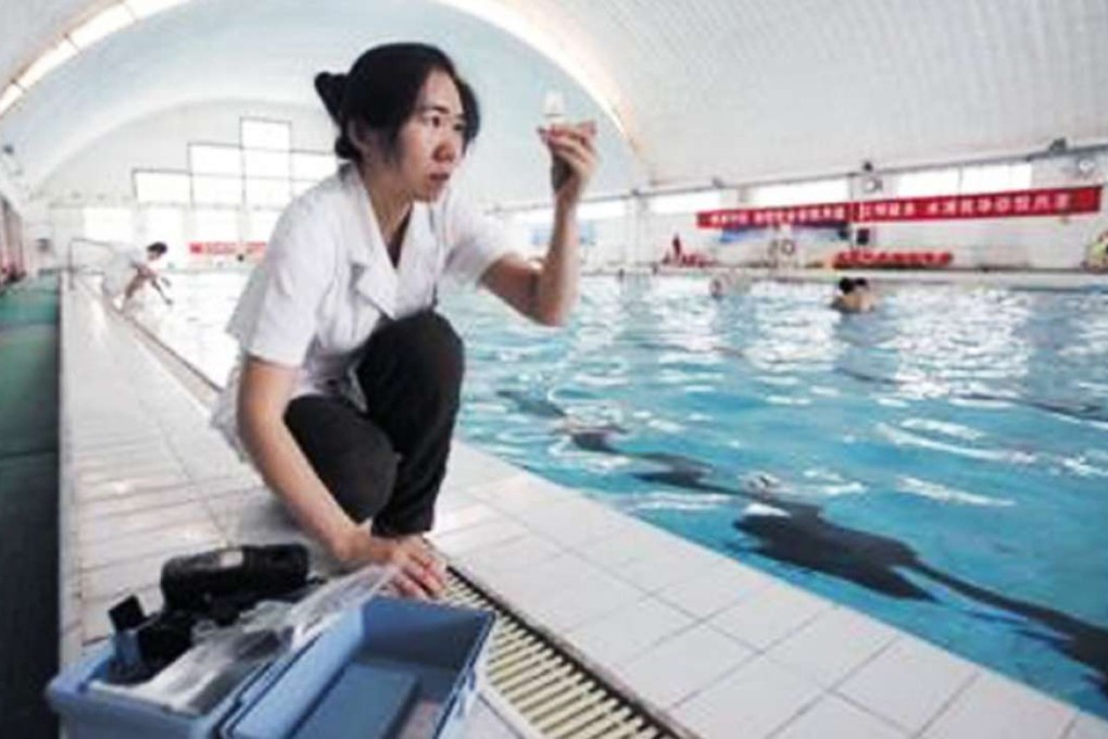 A technician takes water samples from a pool in Beijing. Photo: SCMP Pictures)