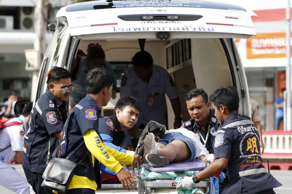 Thai rescue workers rush an injured victim to a hospital after two bombs exploded at the city clock tower in the centre of Hua Hin on August 12. Photo: EPA