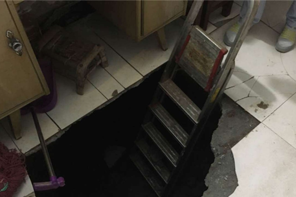 The man fell into a three-metre-deep sinkhole that appeared in the lounge floor of a house in city of Xian last Thursday. Photo: SCMP Pictures