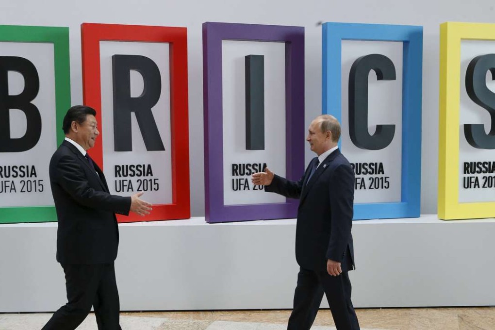President Xi Jinping is greeted by Russian President Vladimir Putin last year’s BRICS Summit in Ufa, Russia. Photo: Reuters