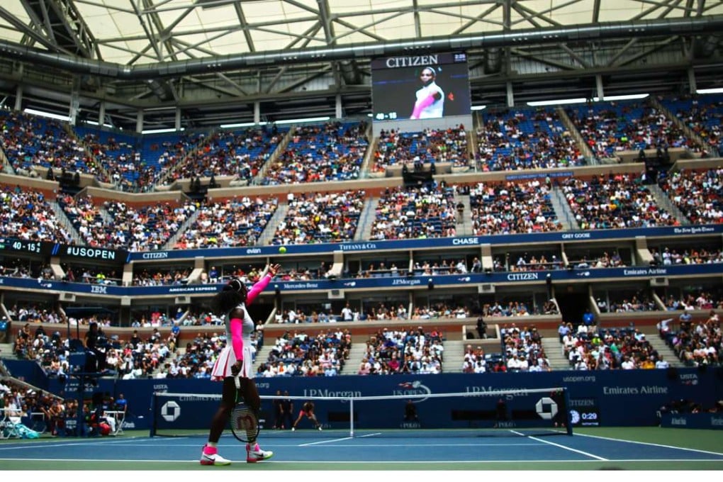 Serena Williams serves to Johanna Larsson of Sweden during the match where she broke the record for most grand slam wins by a woman with 307. Photo: AFP