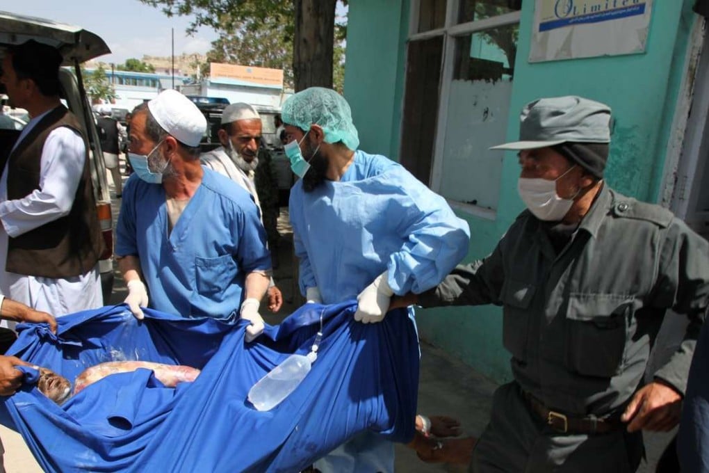 Medical staff help a man injured in a fiery road collision in May. Afghanistan has some of the world’s most dangerous roads, often in dilapidated condition and traffic rules are seldom enforced. File photo: Xinhua