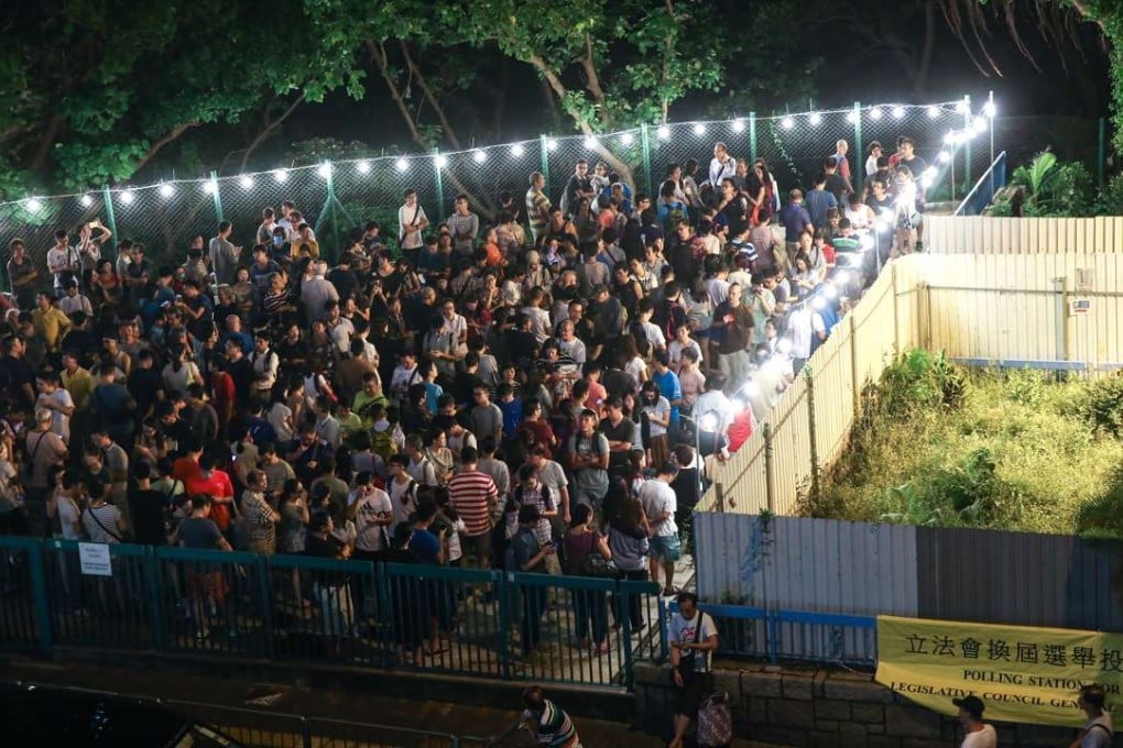 People queue up to vote for 2016 Legislative Council General Election at a polling station in Lam Tin. Photo: Sam Tsang