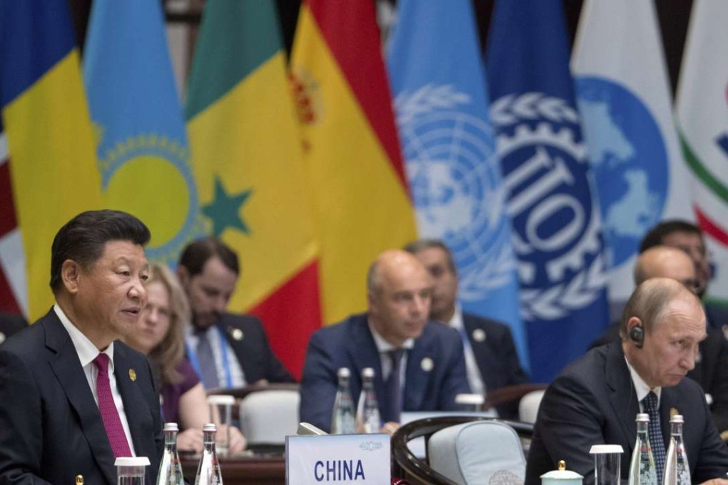 Russia’s President Vladimir Putin (right) listens to the translation as President Xi Jinping speaks during the G20 summit in Hangzhou on Sunday. Photo: EPA , China, 04 September 2016. The G20 Summit is held in Hangzhou on 04 to 05 September. EPA/MARK SCHIEFELBEIN / POOL