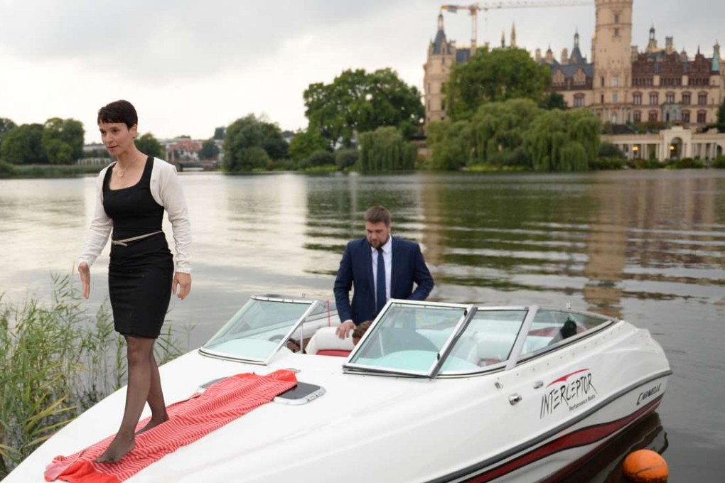 Frauke Petry, leader of the anti-migrant populists AfD arrives in a boat for an election results party on Sunday in Schwerin, north-eastern Germany. Photo: AFP