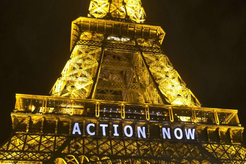 The Eiffel Tower lights up with the slogan"Action Now"before the UN Climate Change Conference in Paris in December, 2015. Photo: AP