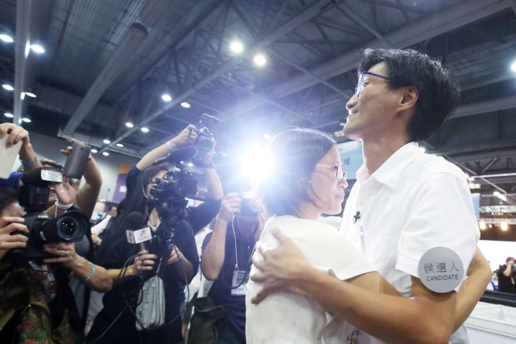 Eddie Chu Hoi-dick(right) and his wife at the 2016 Legislative Council General Election Central Counting Station at the AsiaWorld-Expo. Photo: Felix Wong