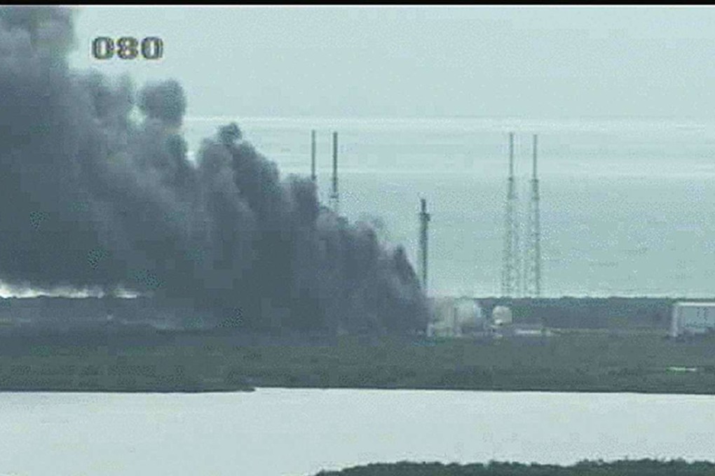 A handout image from a Nasa video camera shows a fire burning on a launch pad after the blast that destroyed a SpaceX Falcon 9 rocket last week. Photo: EPA