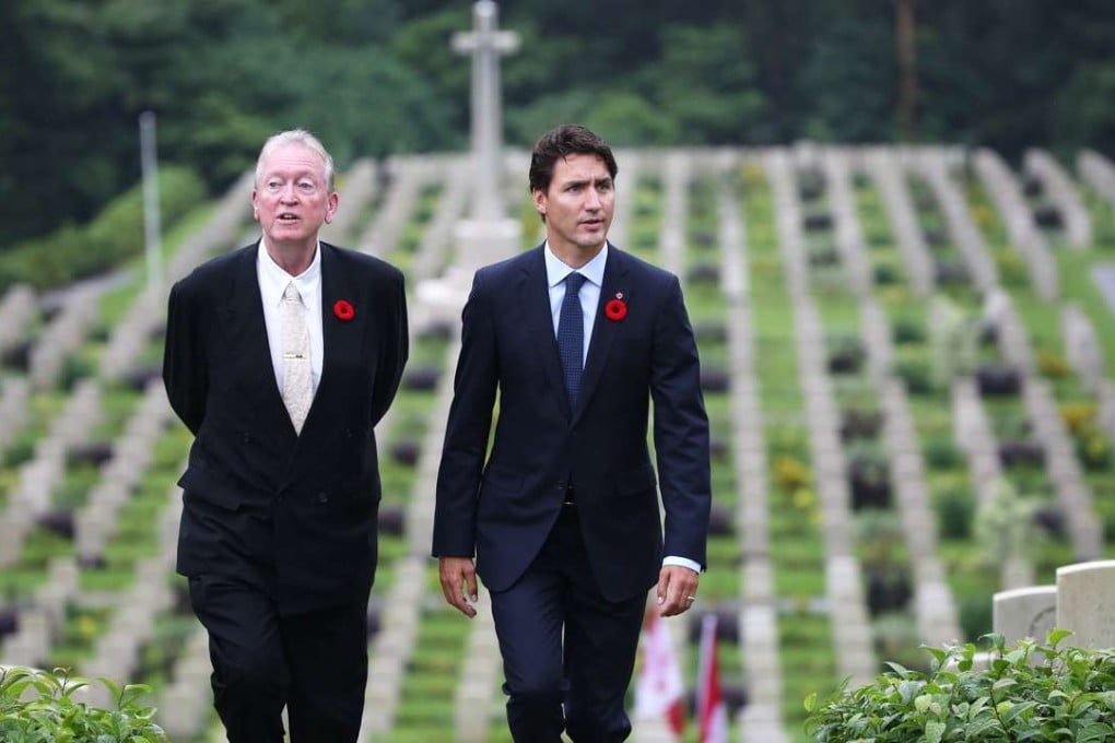 Canadian prime minister Justin Trudeau (right) with British historian Tony Banham at the Sai Wan War Cemetery to pay their respects to fallen soldiers. Photo: Sam Tsang