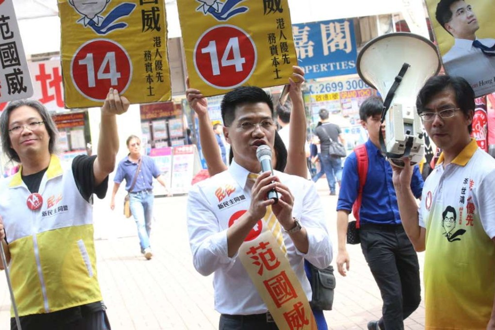 Fan (centre) outside Tai Wai station on Sunday. Photo: David Wong