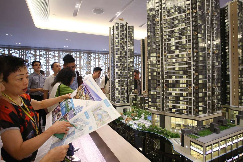 Potential buyers attend sales office of the One Kai Tak development at Exchange Tower in Kowloon Bay. Photo: Dickson Lee