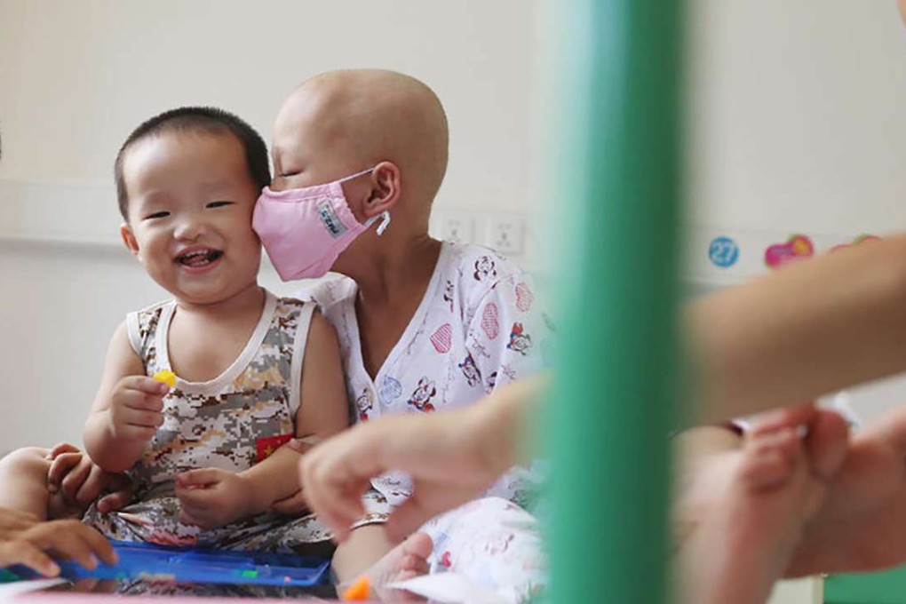 Zhuang Qian Qian (right) hugs her youngest brother, who provided her with the lifesaving blood cord transplant. Photo: SCMP Pictures