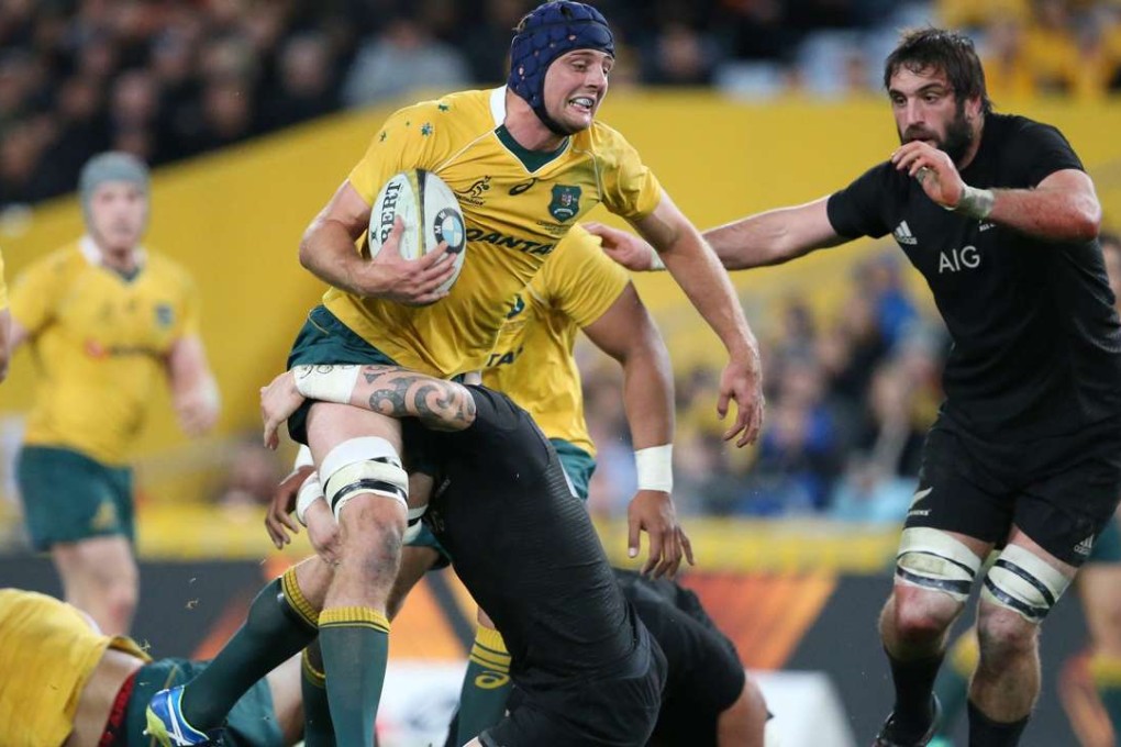 Australia's Dean Mumm runs with the ball during the Bledisloe Cup match between New Zealand. Photo: EPA