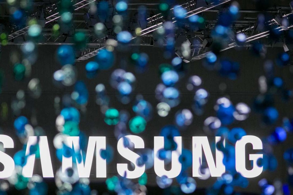 A Samsung logo stands illuminated during a news conference as South Korea won a WTO decision against the US on washing machines. Photo: Bloomberg