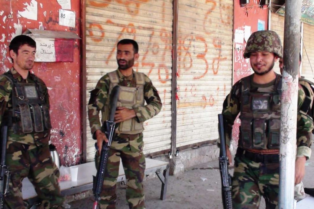 Afghan security force members stand guard in the capital of Uruzgan province, Afghanistan. Photo: Xinhua
