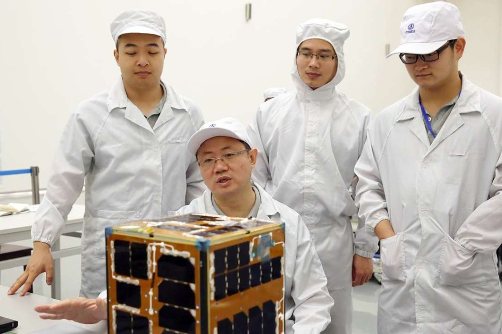 Researchers at Northwestern Polytechnical University and their “cubesat”, which was launched at the Hainan Satellite Launch Centre in June. Photo: Nwpu.edu.cn