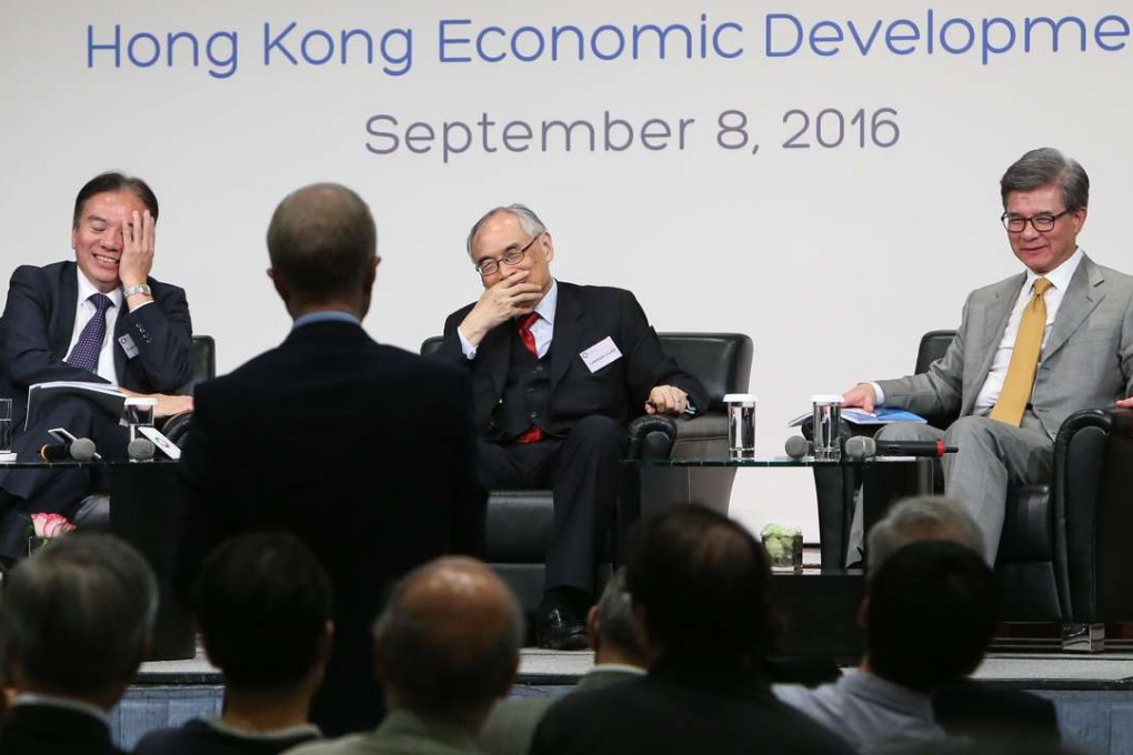 In discussion (from left) are Dr David Wong, Lawrence Lau and Vincent Lo Hong-sui, chairman of the Shui On Group. Photo: Dickson Lee