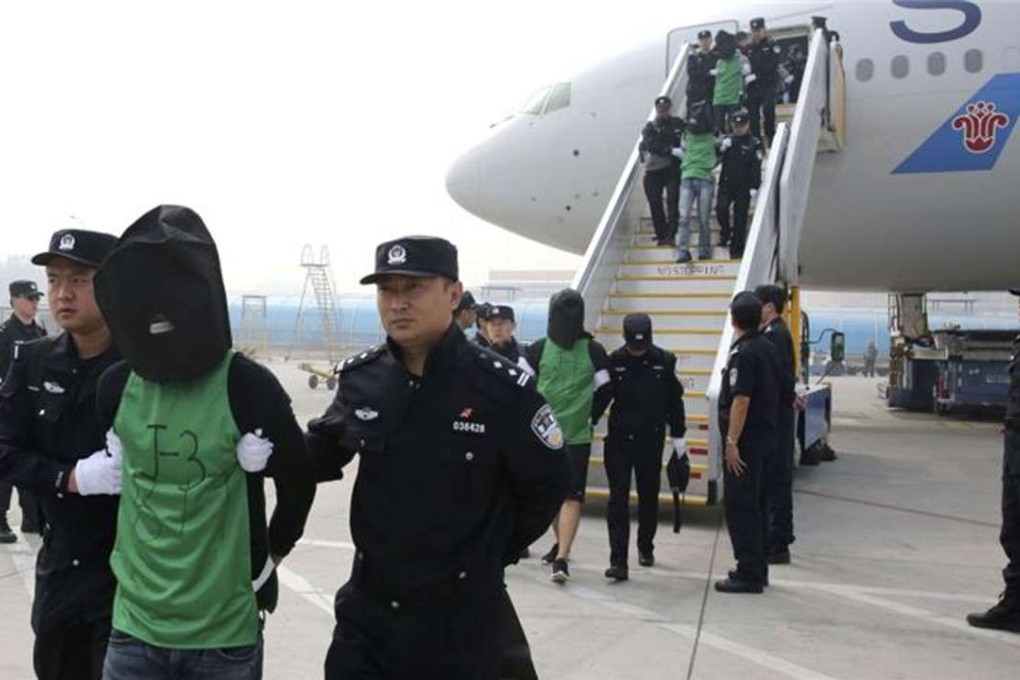 A file picture of Taiwanese fraud suspects arriving in Beijing from Kenya in April. Photo: AP