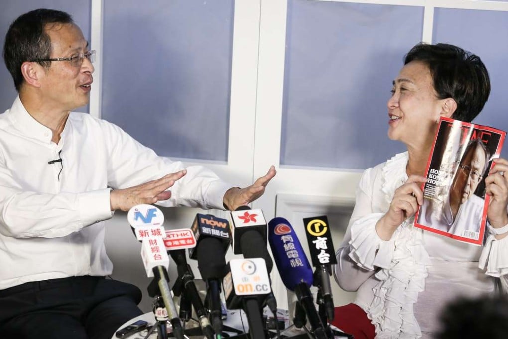 Emily Lau (right) confronts Jasper Tsang with a copy of Time magazine. Photo: K. Y. Cheng