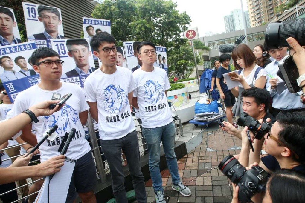 Alan Li Tung-sing, Sixtus “Baggio” Leung Chung-hang, and Edward Leung Tin-kei, pay gratitude to their supporters in Tseung Kwan O after Baggio won a seat in New Territories East. Photo: David Wong