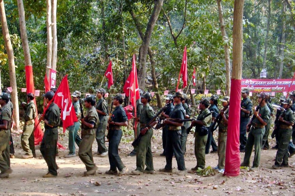 Maoist rebels march in the jungles of the Indian state of Chhatisgarh, 1,500km southeast of New Delhi. The rebels, who claim to be inspired by Chinese revolutionary Mao Zedong, have been fighting in several Indian states, demanding land and jobs for agricultural labourers and the poor. Photo: AP