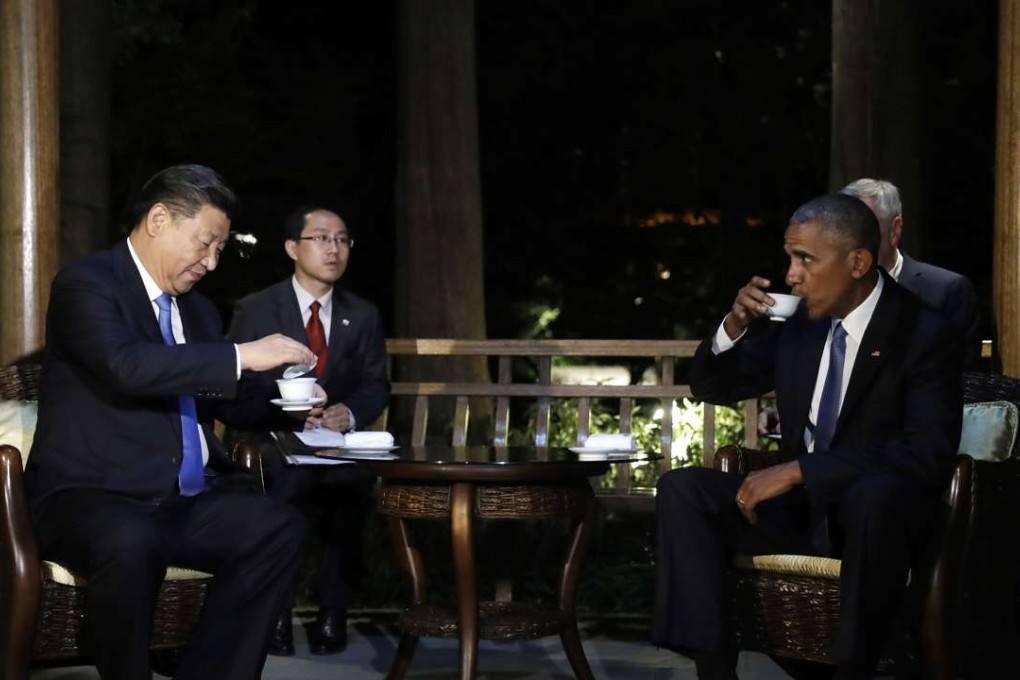 President Xi Jinping and US President Barack Obama hold talks over tea in a pavilion at the West Lake State Guest House in Hangzhou. Photo: AP