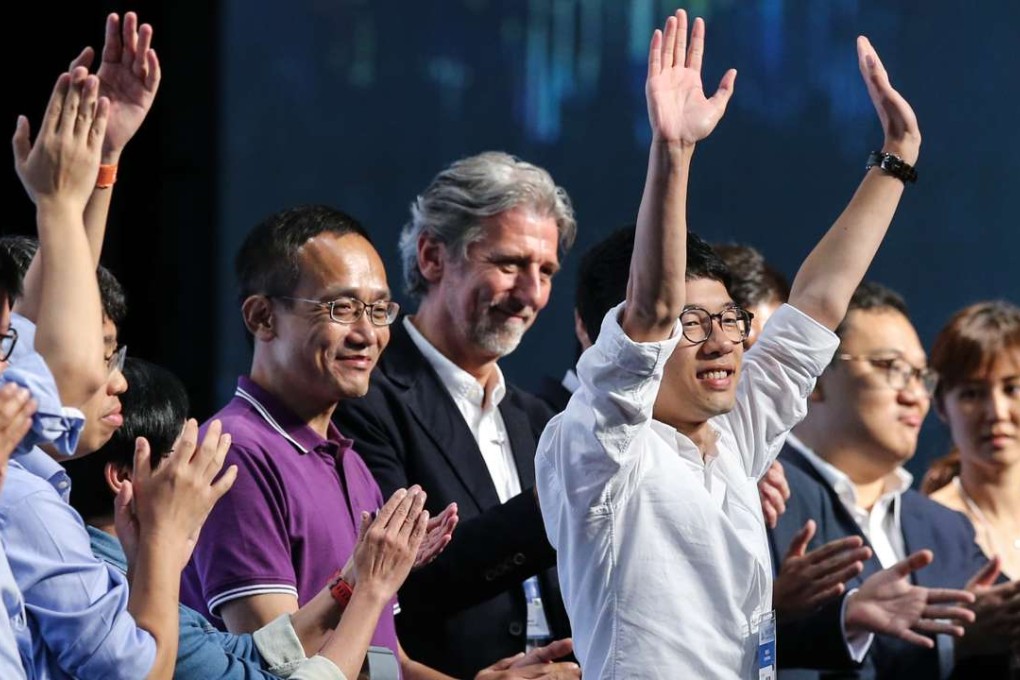 Nathan Law Kwun-chung (white shirt) wins his seat on Legco. Photo: Sam Tsang