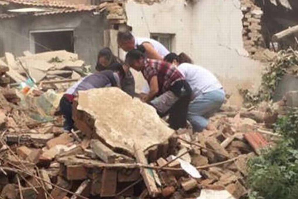 Relatives search for the Chinese grandmother, 92, amid the debris of her demolished house. Photo: SCMP Pictures
