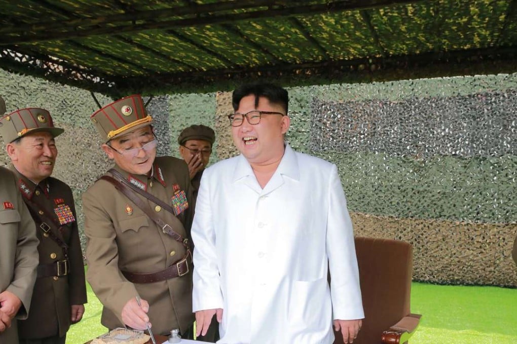 A photo provided by Korean Central News Agency on Tuesday shows leader Kim Jong-un at a test of ballistic rockets. Photo: Xinhua