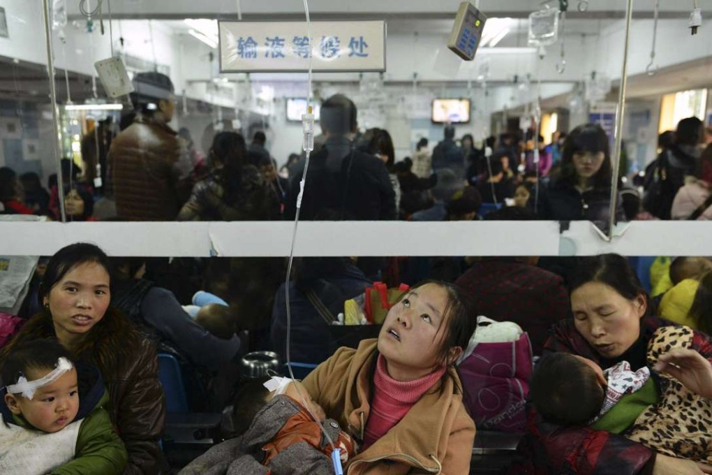 Mothers hold their children during treatment at a hospital in Hangzhou, Zhejiang province. Photo: Reuters