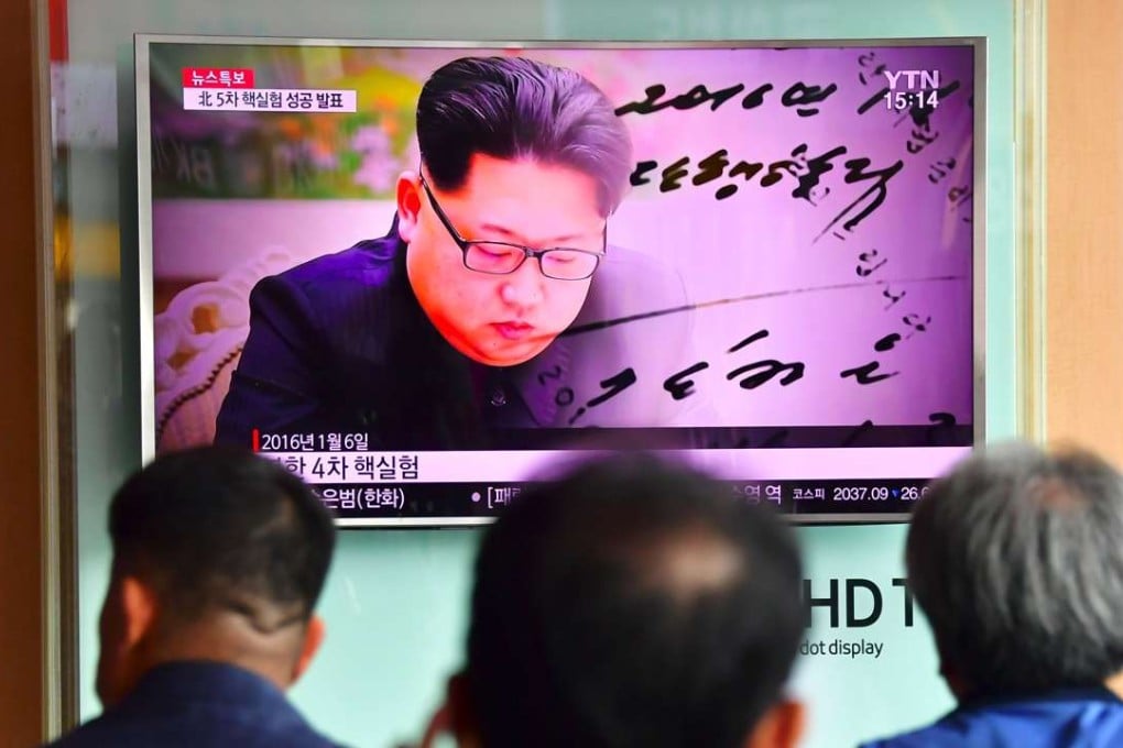 Commuters watch television footage of North Korean leader Kim Jong-un, at a railway station in Seoul on September 9. Photo: AFP