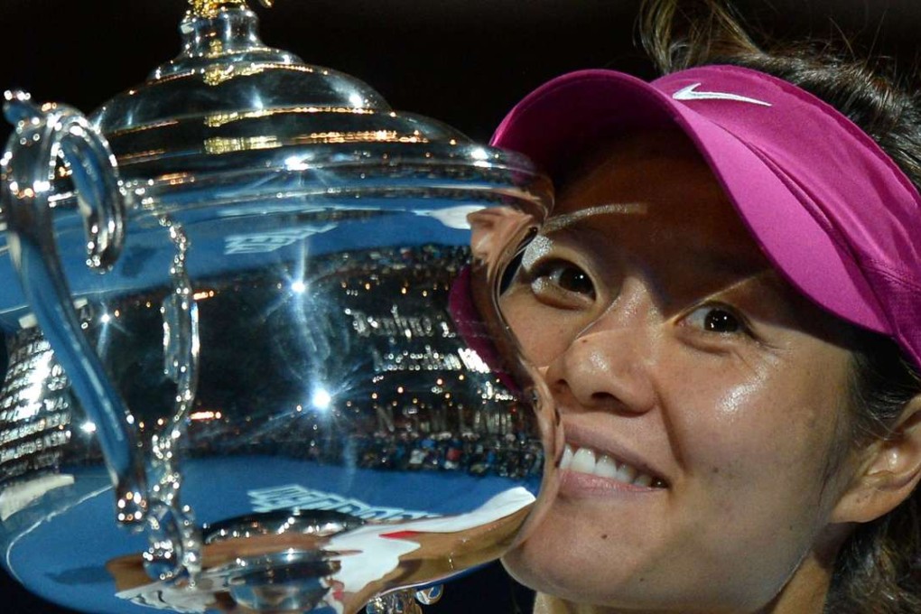 Li Na poses with the trophy after winning the 2014 Australian Open. Photo: AFP