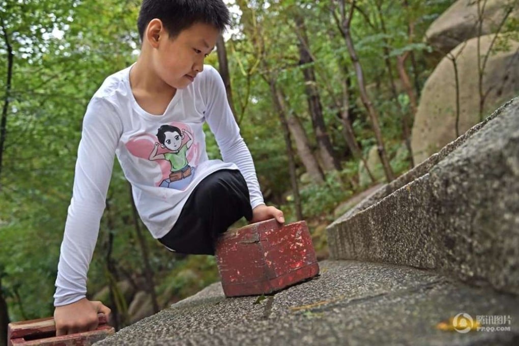 Chinese boy Gao Zhiyu, 11, climbed 900 metres up Mount Lao, in China’s eastern Shandong province, before having to stop because of severe blister. Photo: SCMP Pictures.