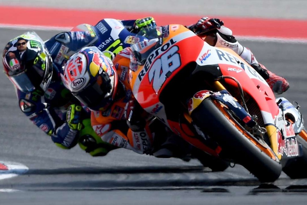 Spain’s Dani Pedrosa leads Italian rider Valentino Rossi during the San Marino MotoGP. Photo: AFP