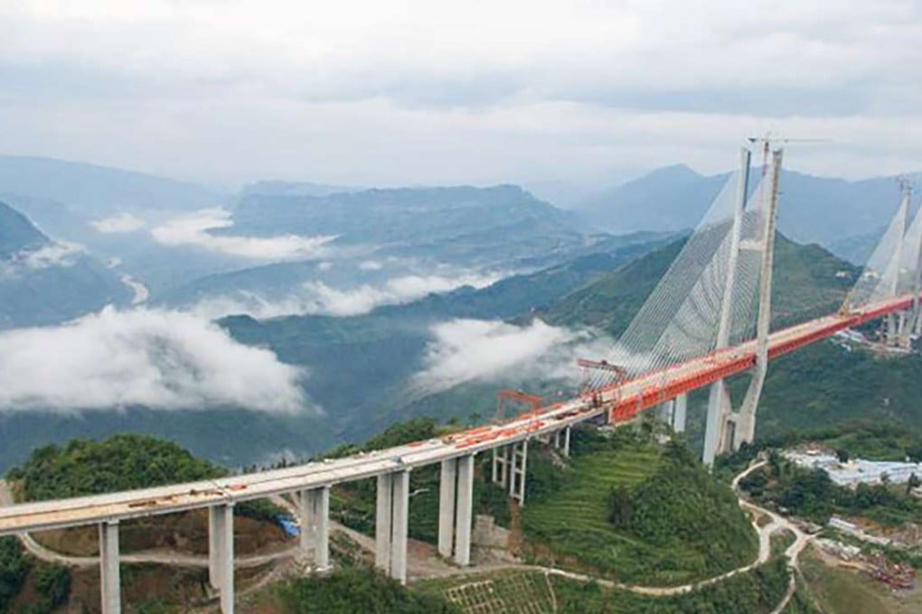 The main span of China’s new Beipanjiang road bridge, connecting Yunnan province and Guizhou province, was completed on Saturday. Photo: SCMP Pictures
