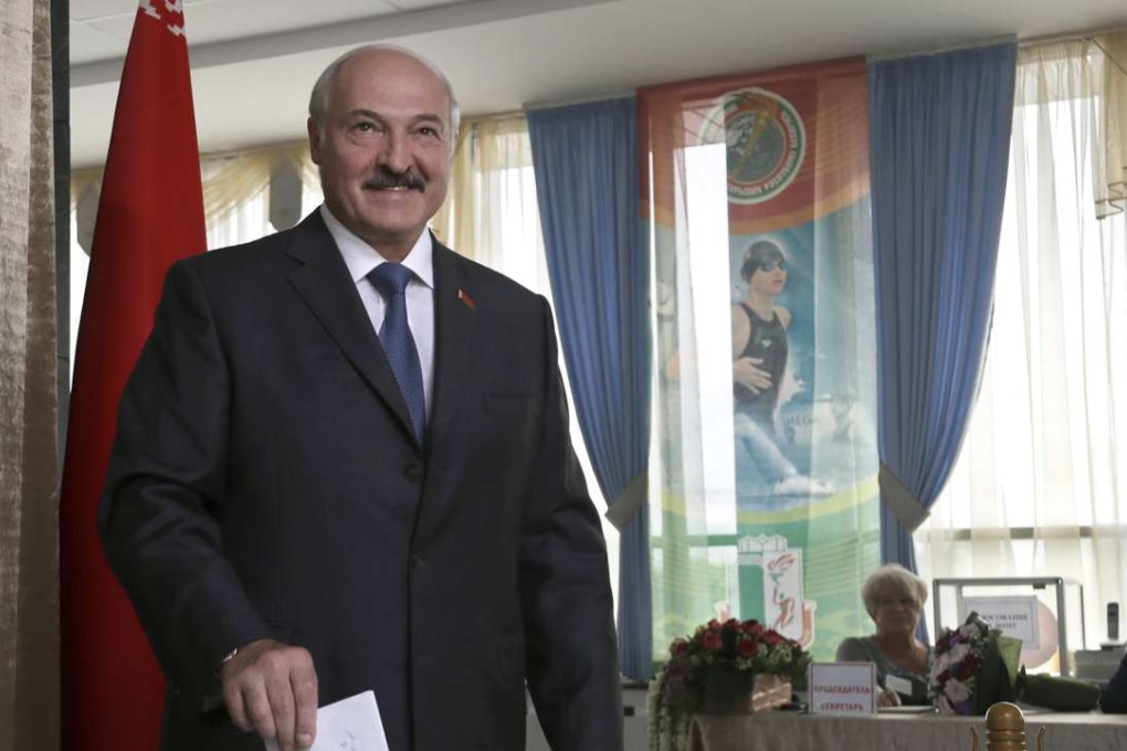 Belarusian President Alexander Lukashenko poses for photographers as he casts his ballot during parliamentary elections in Minsk, Belarus, on Sunday. Photo: AP