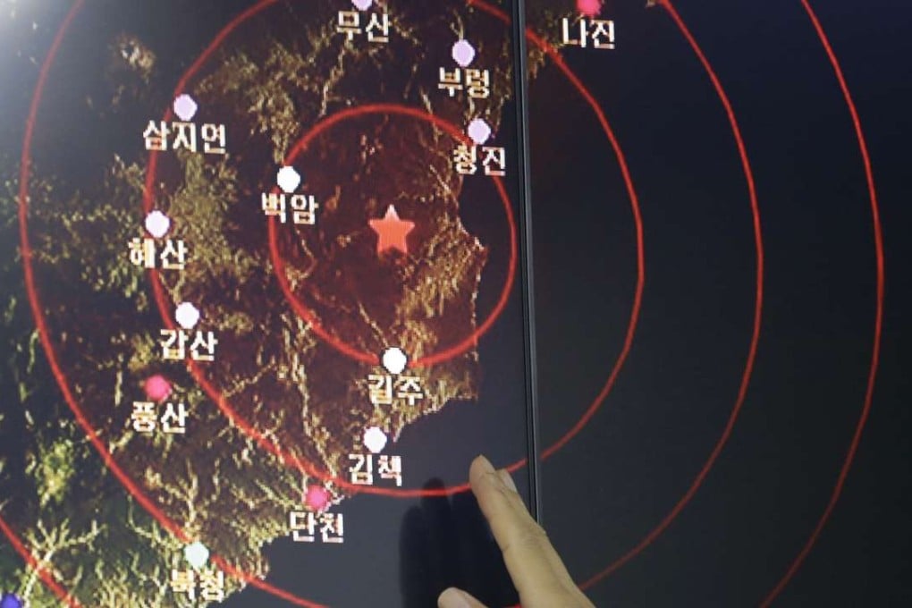 An official in Seoul points to a graphic that shows seismic waves created by North Korea’s blast on Friday. Photo: AP