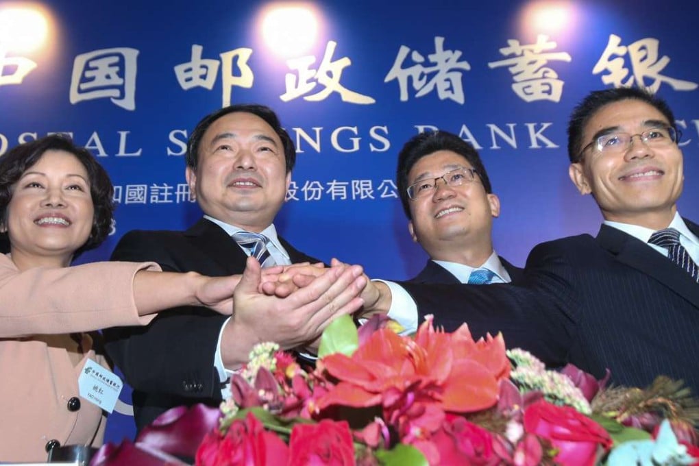 From left; Yao Hong, executive director and vice president; Li Guohua, chairman; Lyu Jiajin, executive director and president; and Xu Xueming, vice president and secretary to the board, at the Postal Savings Bank of China’s IPO press conference in Hong Kong on Tuesday. Photo: David Wong