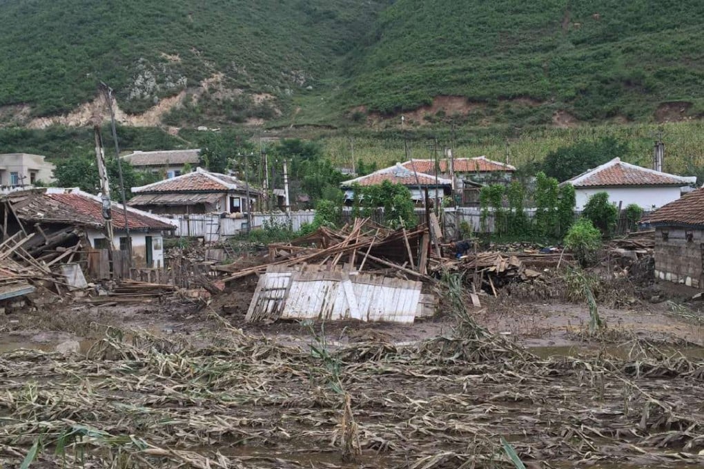 Damage to crops and houses caused by heavy flooding of the Tumen river along the road from Musan to Yonsa in North Hamyong province. Photo: AFP