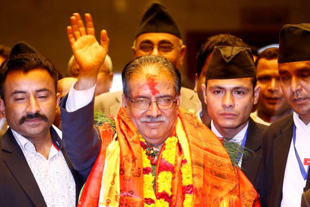 Nepal's Prime Minister Pushpa Kamal Dahal, also known as Prachanda, waves towards the media after he was elected in August, 2016. Photo: Reuters