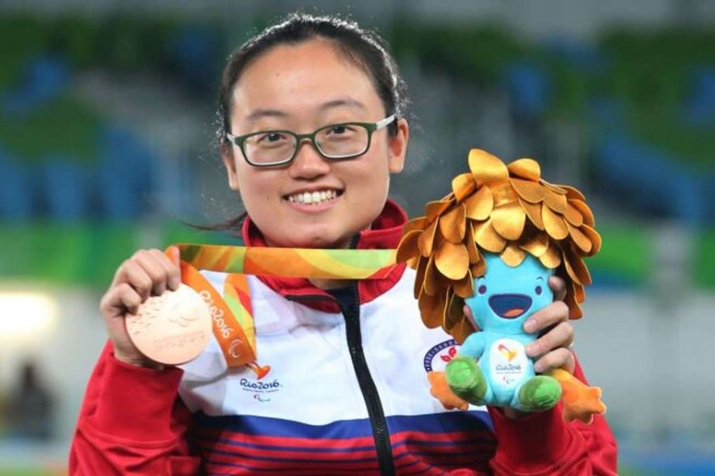 Chan Yui-chong shows off her bronze medal. Photos: HK Paralympic Committee