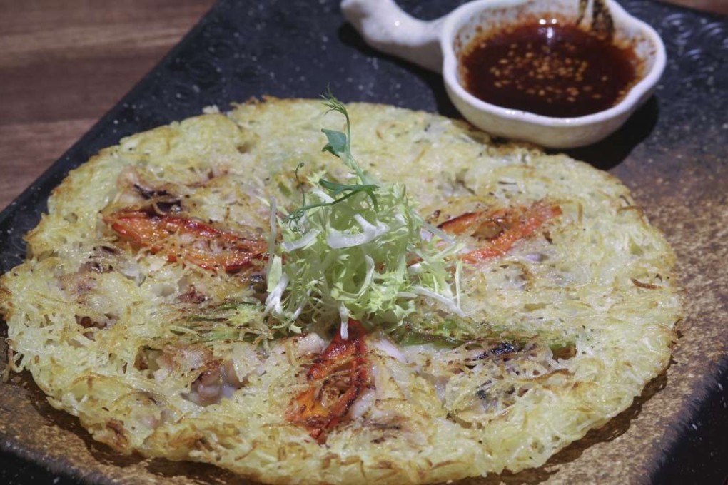 Pan-fried shredded potato pancake with seafood. Photos: Antony Dickson