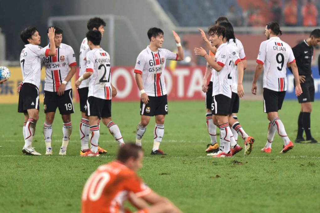 FC Seoul players celebrate after beating China’s Shangdong Luneng in Jinan. Photo: Xinhua