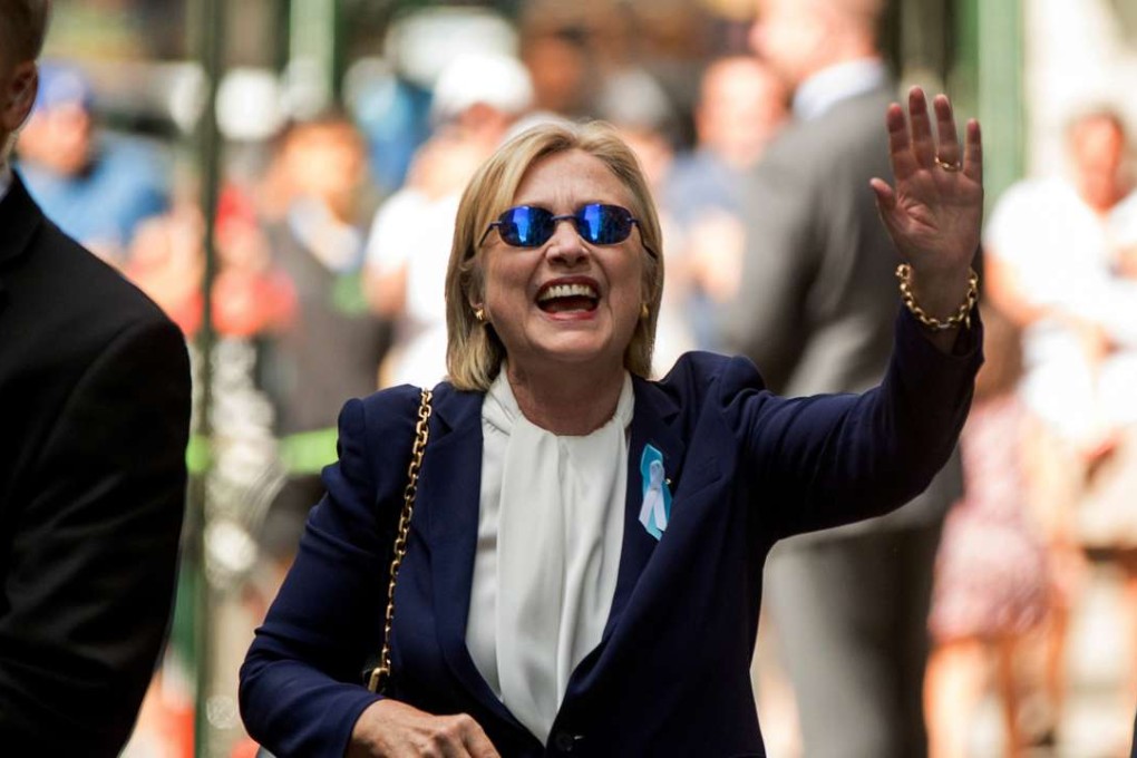 Democratic presidential candidate Hillary Clinton waves after leaving an apartment building in New York. Photo: AP