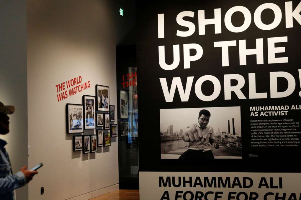 A man looks up at an exhibit on boxing great Muhammad Ali during a media preview day at the National Museum of African American History and Culture on the National Mall in Washington. Phto: Reuters