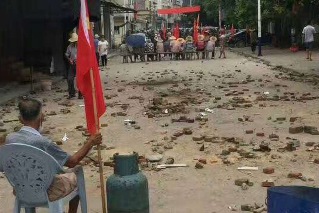 Villagers face off with security officers in Wukan in Guangdong province on Tuesday. Photo: SCMP Pictures